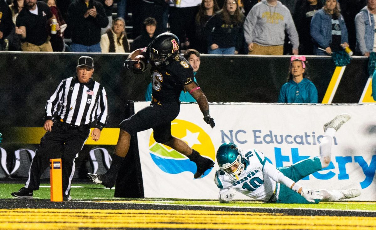 Former App State running back Cam Peoples breaks free from a Chanticleer defender Oct. 20, 2021. The Mountaineers upset then No.14 Coastal Carolina 30-27.