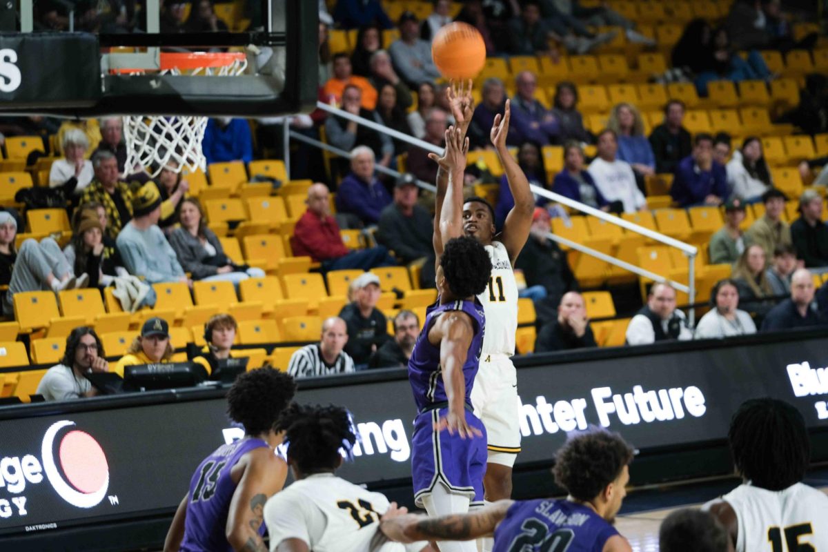 Forward Donovan Gregory shoots a fadeaway over a Furman defender Nov. 11, 2022. Gregory enters his fifth season with the Mountaineers.