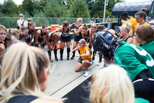 App State Field Hockey head coach Emily Dinsmore speaks to her team against Liberty Aug. 18, 2023.