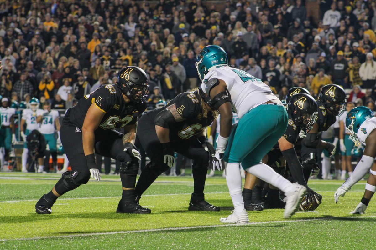App State offensive lineman prepare for the snap against Coastal Carolina Oct. 10. The Mountaineers posted 111 rushing yards. 