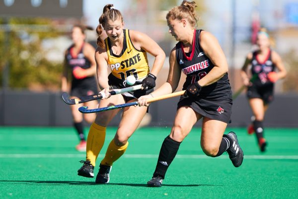 Freshman midfielder Kassie Paul battles a Cardinal player for possession Oct. 22. App State earned their first top 10 win in defeating Louisville 2-1.