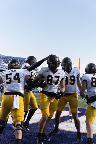 A group of Mountaineers celebrate in the end zone after a touchdown against No. 18 James Madison Nov. 18.