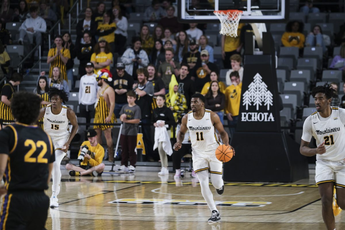 Graduate student forward Donovan Gregory brings the ball up the court against Carlow Dec. 7, 2022. App State welcomes Auburn Sunday for the first power-five matchup in Boone since 2000.