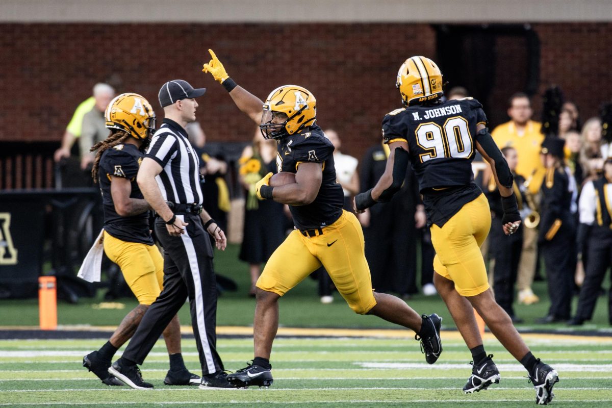 Redshirt senior linebacker Andrew Parker Jr. runs across the field after his interception against Southern Miss Oct.28. The New Orleans native is up to 72 total tackles on the season.  
