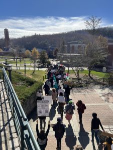As the rally attendees marched, they held handmade signs high above their heads and waved flags. The march started at the Jones House Cultural Center, ended at Sanford Mall and lasted around 15 minutes. 