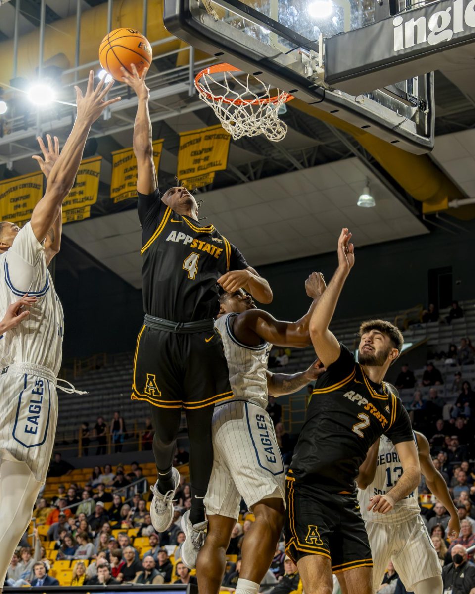 App State beats rival Georgia Southern 84-74 on Jan. 25, 2024. Freshman guard Jordan Marsh jumps for a basket with junior forward Chris Mantis by his side.