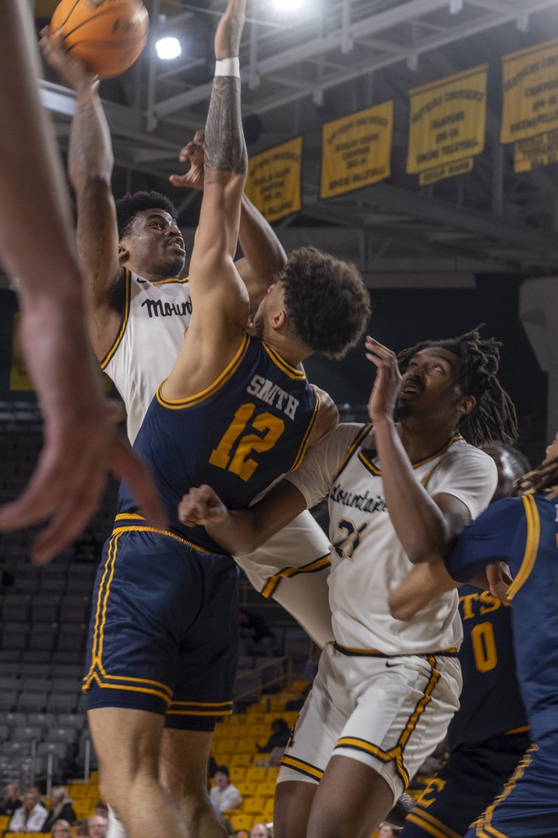 Graduate student Donovan Gregory shoots over a ETSU defender Nov. 29, 2023. Gregory is second on the team at 12.8 points per game.