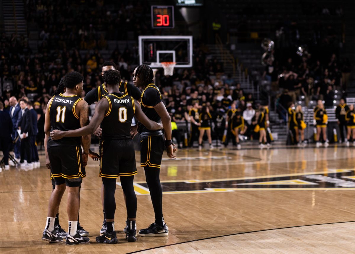 App State players meet during a timeout against Georgia Southern Jan.25. The Mountaineers downed the Eagles 84-74.