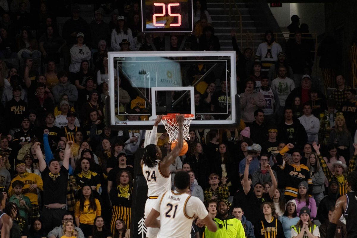 Junior forward TreVon Spillers dunks a ball against Georgia State Jan. 17. The Black and Gold currently sit in first place in the Sun Belt.