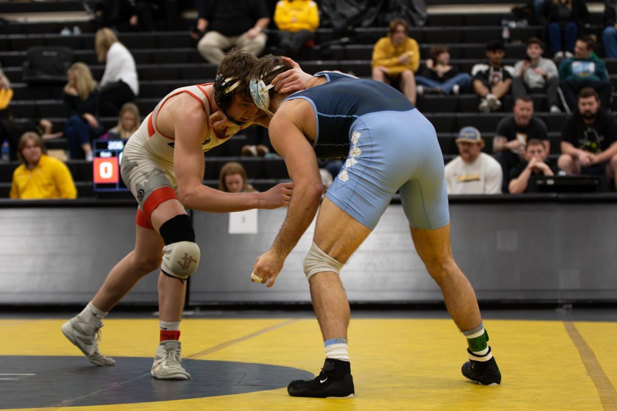 Two wrestlers square off in Varsity Gym in the Appalachian Open Jan. 27.