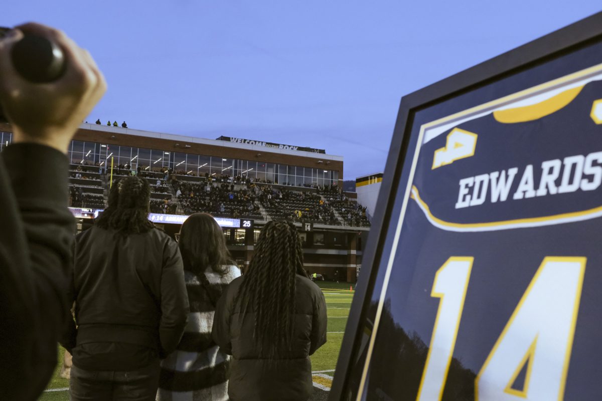 Armanti Edwards and his family watch as his No. 14 is retired during the last game of the 2023 season Nov. 26, 2023. Edwards won back-to-back Walter Payton awards in 2008 & 2009, an honor given to the best offensive player in FCS.