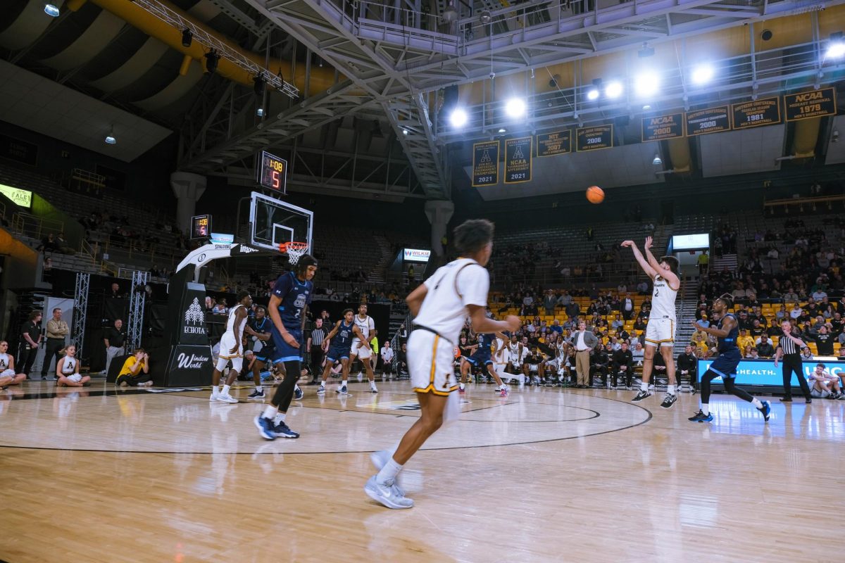 Junior forward Christopher Mantis takes a jumpshot three in the second half of App State’s home game against ODU on Wednesday,. Feb. 289. Mantis recorded 12 points and two rebounds during App State’s win.