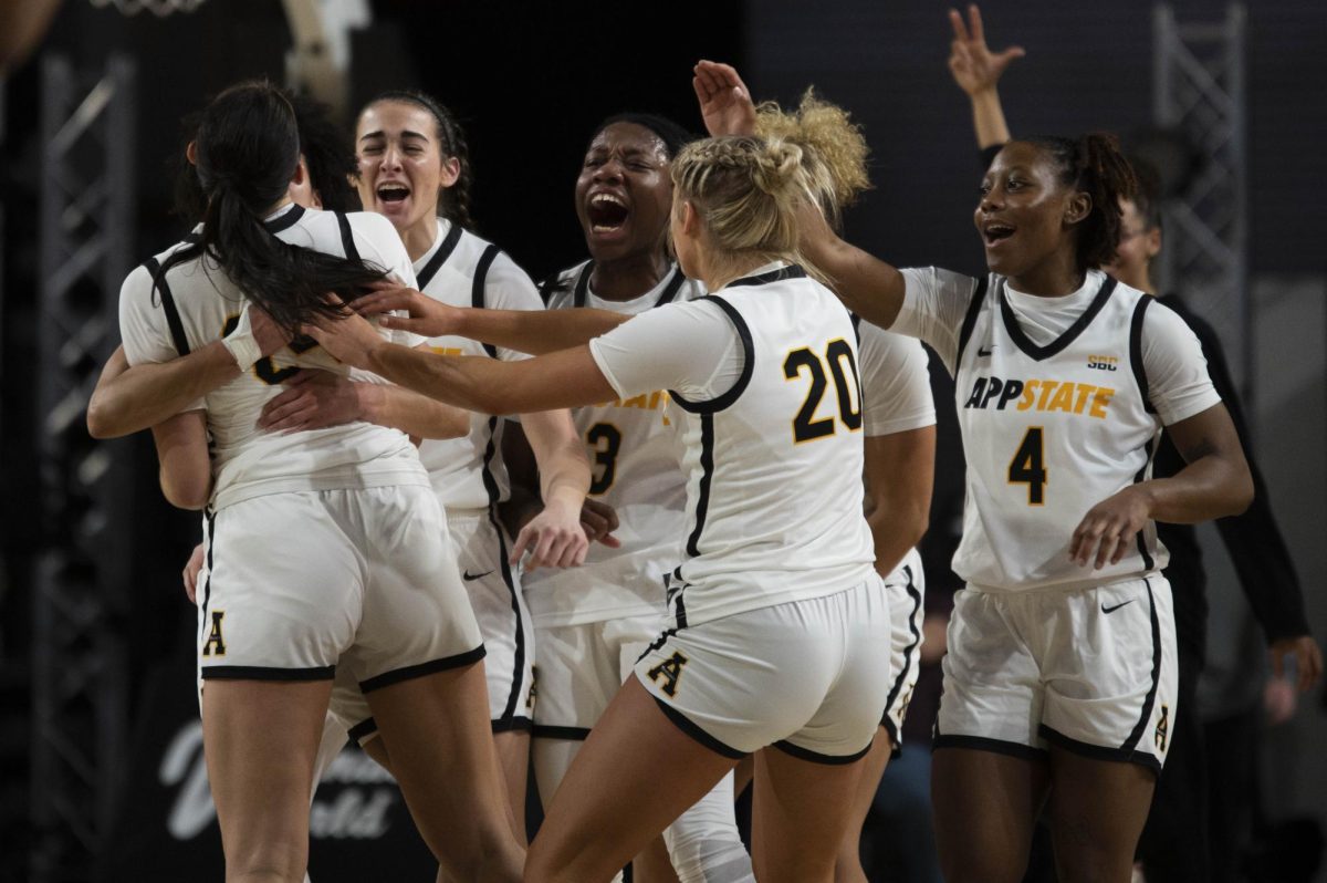 The team celebrates in their home court 73-63 win against Coastal Carolina Jan. 18, 2024. The win moves them to 11-11 on the season.