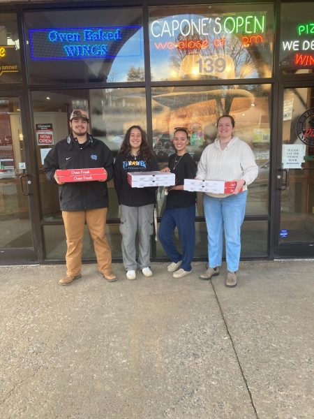 SAIM members pick up pizzas from Capones before delivering them to families in need Feb. 5, 2024. (Courtesy of Allen Bryant)