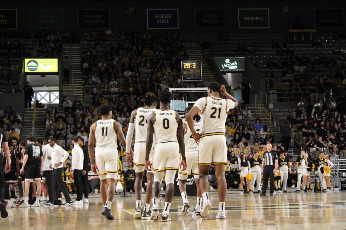 The Mountaineers walk back onto the court against Ragin Cajuns Feb. 17. The Black and Gold have won five straight games.