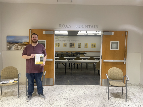 Zachary Lachance, a lecturer in the accounting department, poses with a picture outside of the tax filing help session. The session was held noon-4 p.m. on Thursday in the Plemmons Student Union alongside graduate student Micah Carroll. 