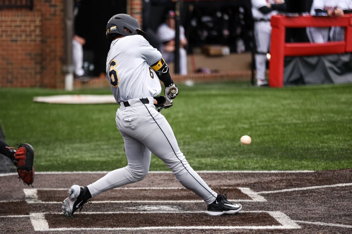 Junior infielder Joseph Zamora swings at a low pitch against Gardner-Webb Feb. 16. The Mountaineers opened their season 2-1 with a series against the Runnin Bulldogs.
