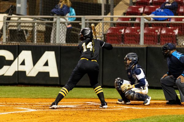 Graduate student catcher Peyton Darnell gets ready for a pitch against Kent State Feb. 9. Darnell recorded her first career App State home run.