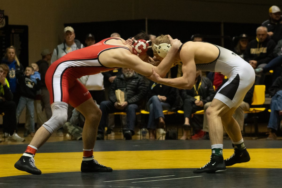 Junior+165-lb+Will+Miller+faces+off+against+a+Cornell+opponent+Feb.+18.