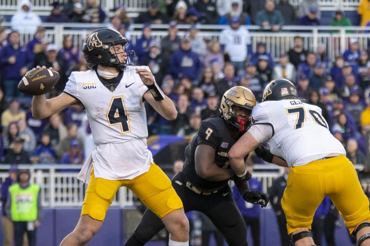 Quarterback Joey Aguilar looks downfield against No. 18 James Madison Nov. 18, 2023. The Mountaineers and Dukes will face off in Boone Nov. 23, 2024.
