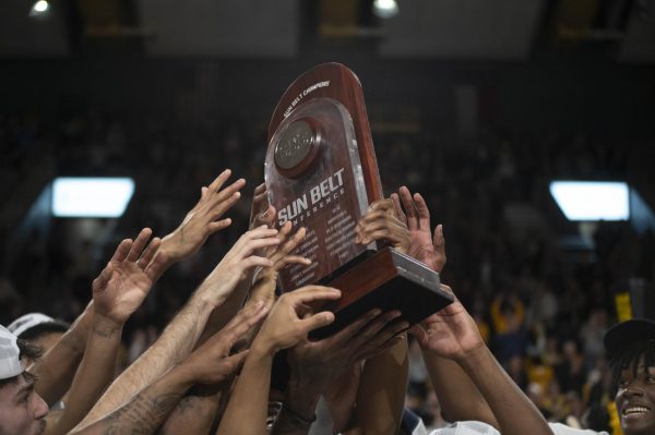 The team hoists up the regular season Sun Belt Championship award after their game against Arkansas State March 1. With a 26-5 regular season record, App State earns their first ever title in the Sun Belt division since joining for the 2014-15 season.