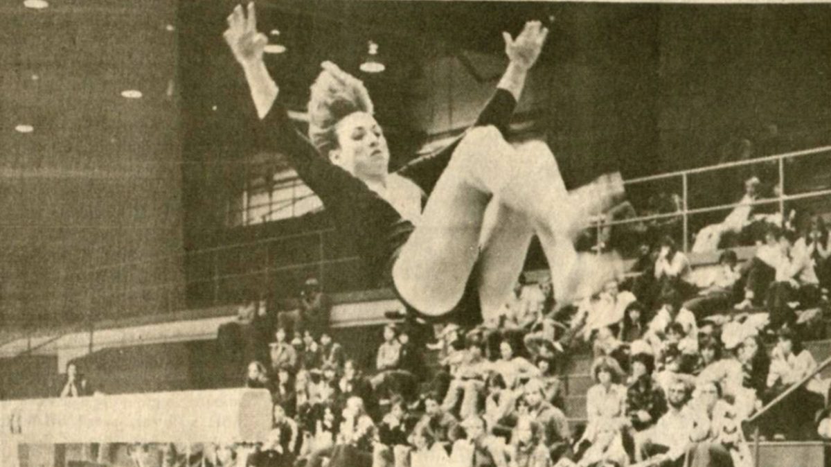 Michelle Driscoll comes off balance beam with a hair-raising,
heart-stopping finish in Georgia meet Friday. Photo originally published in The Appalachian Dec. 5, 1978.