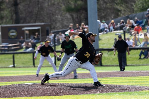 Senior pitcher Dante Chirico throws a pitch against a Marshall batter in the seventh inning March 30. The Mountaineers won the game in dominant fashion with a score of 19-2. 
