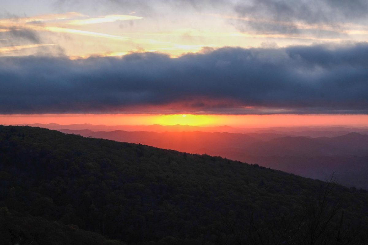 The sunrise over the Blue Ridge Mountains can be seen from the wooded walkway a part of the Rough Ridge trail on March 11.