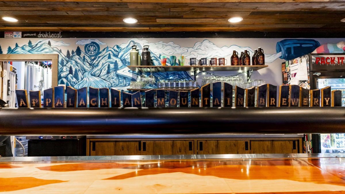  A row of wooden beer taps engraved to spell out “Appalachian Mountain Brewery” set and ready to pour on March 1. Founders Nathan Kelischek and Chris Zieber bought back AMB in 2023 from Anheuser-Busch.
