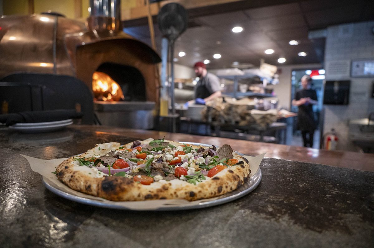  A greek seasonal pizza sitting on the bar of Lost Province Brewing Company on March 5. This is one of the many specialty pizzas offered on the menu.
