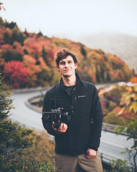 App State alum Max Renfro on the Blue Ridge Parkway during peak week. Renfro graduated with a Bachelor of Business Administration in Digital Marketing in 2022, worked with App State athletics in covering sporting events and creating content, and has received four SAVVY Awards from the Collegiate Sports Video Association.  (Courtesy of Max Renfro)