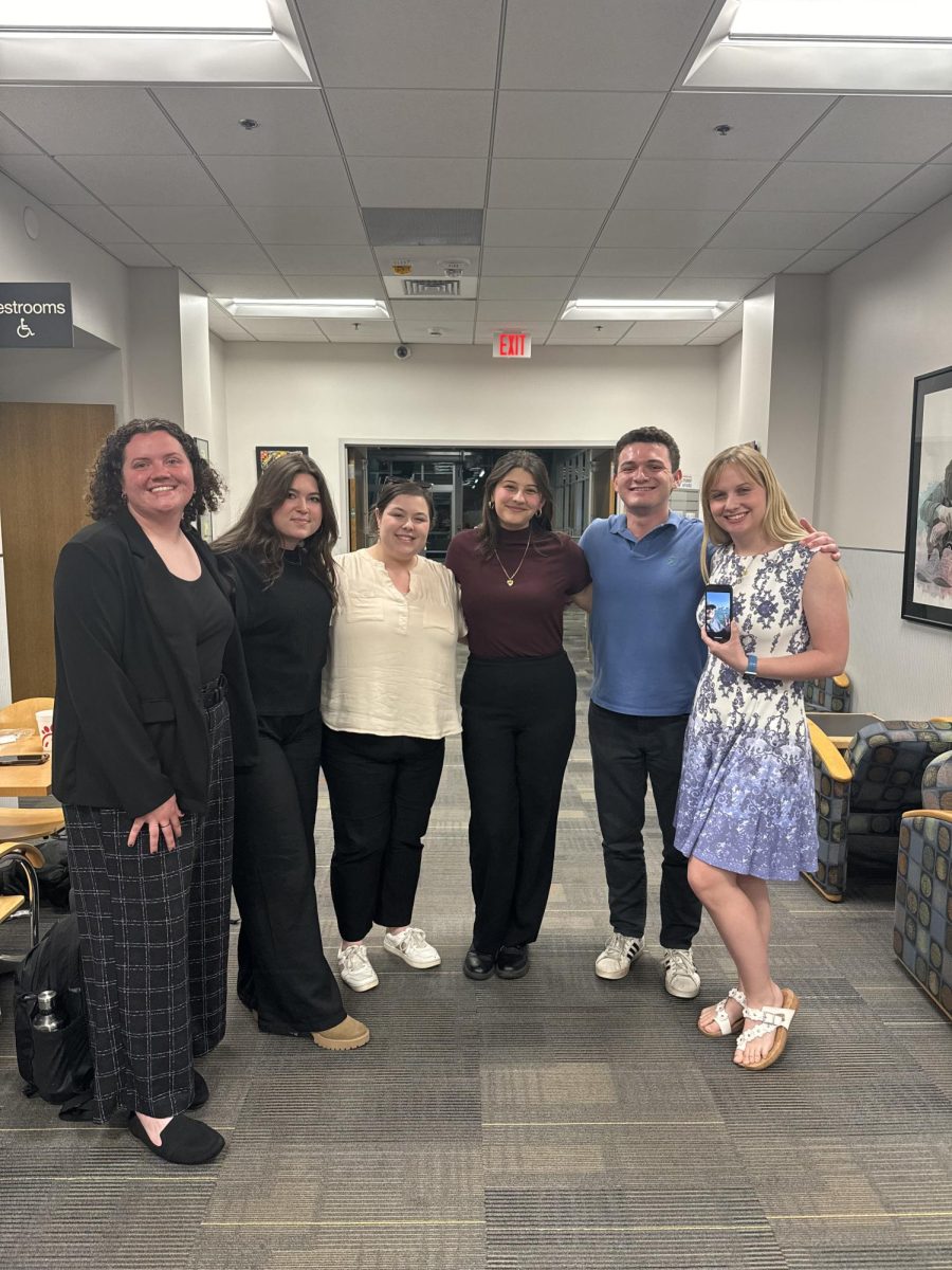 Newly appointed and elected members of the SGA pose in the Plemmons Student Union on April 16. Courtney Castellow (left), Brittany Byrum, Kathryn Long, Amarah Din, Jackson Adams, Kaylee Greene and Hampton Smith (pictured on Greenes phone) will all serve in leadership positions in the 58th session. (Courtesy of Kathryn Long)