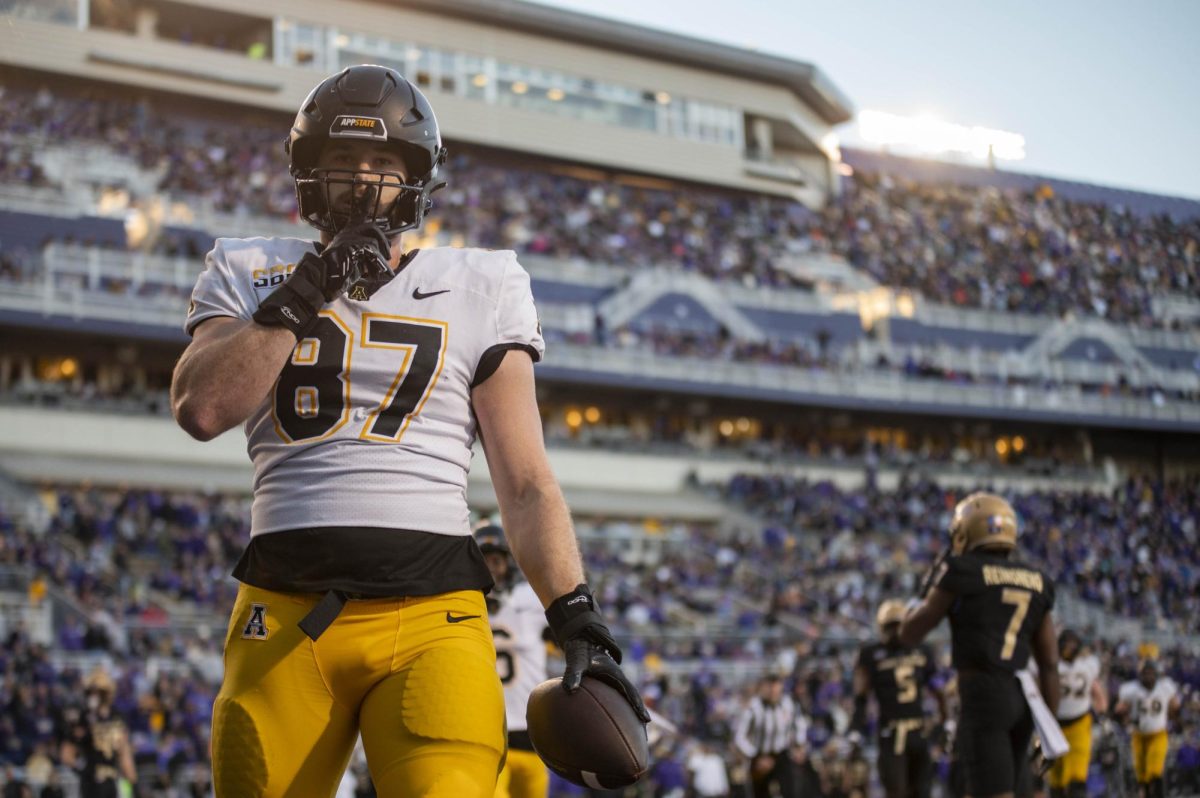 Eli Wilson makes a celebratory pose after making a touchdown against James Madison on Nov. 18, 2023. Wilson is a tight end entering the 2024 season with seven touchdowns.