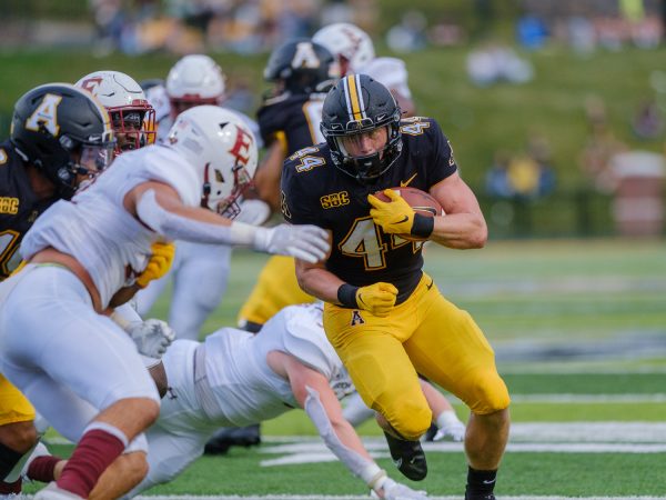 Anderson Castle rushing the field against Elon on Sept. 18, 2021. Castle is a redshirt running back from Boone.