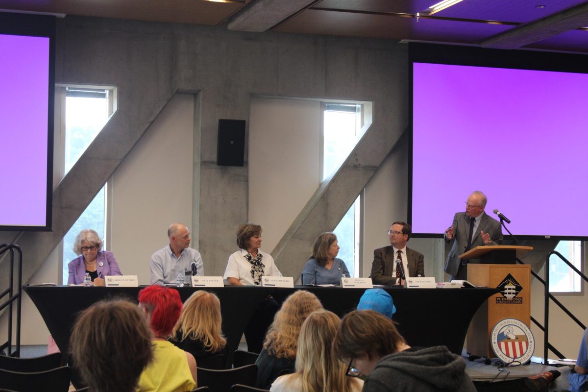 A bipartisan panel of election officials meeting in the Parkway Ballroom of Plemmons Student Union on Aug. 21. The group is discussing how the election process works and is answering any questions from the audience. 