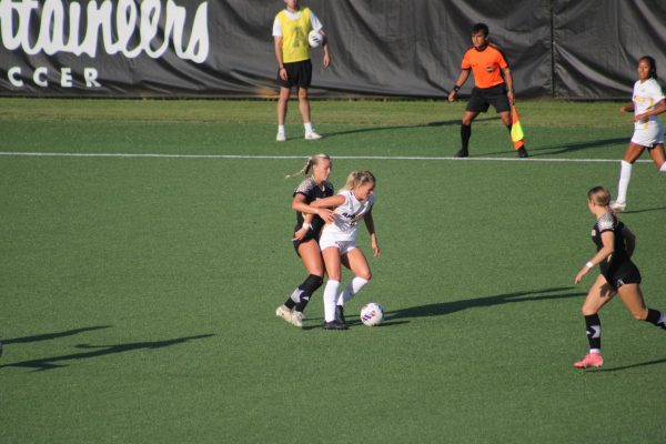 Forward graduate student Izzi Wood shields the ball from Wofford’s defender at the Appalachian Soccer Stadium on Aug. 22. Wood has played for the App State women’s soccer team for four years.