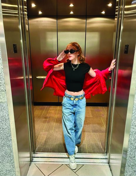 Fashion influencer Zoe Britt poses in an elevator showing off her outfit on Oct. 16, 2023. Britt is a senior apparel design and merchandising major.