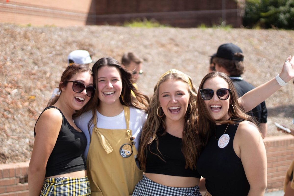 Fans smile for a photo as they attend the App State vs. ECU football game on Sept. 16, 2023. The App State vs. ECU game is one of the most anticipated games of the season due to the university’s rivalry with East Carolina.