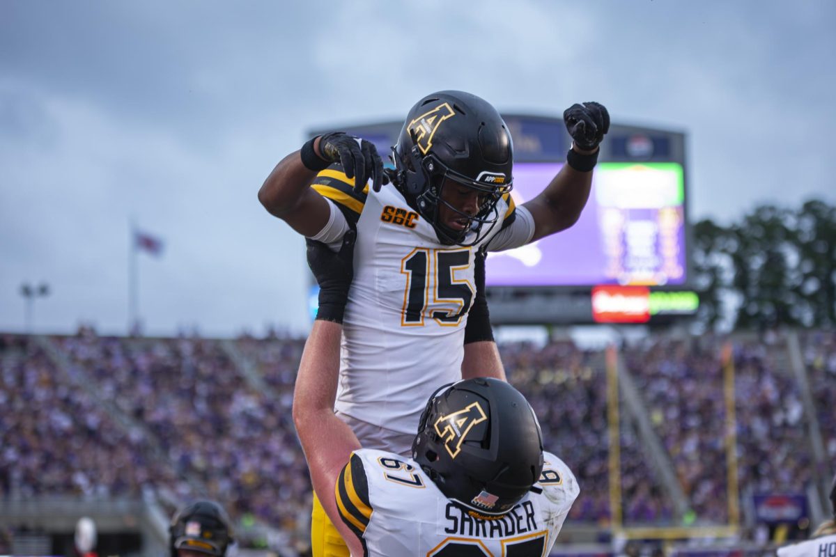 Wide receiver Makai Jackson celebrates with his teammate Thomas Shrader at the App State vs. ECU game on Sept. 14. Last season Jackson caught 27 passes for 418 yards and had two touchdowns.