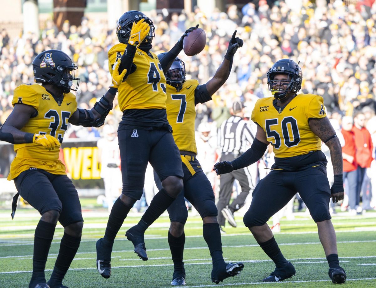 From left, linebacker Jaden McLeod, defensive lineman Hansky Paillant, inside linebacker Trey Cobb and defensive lineman DeAndre Dingle-Prince celebrate after a touchdown against South Alabama on Nov. 13, 2021. 