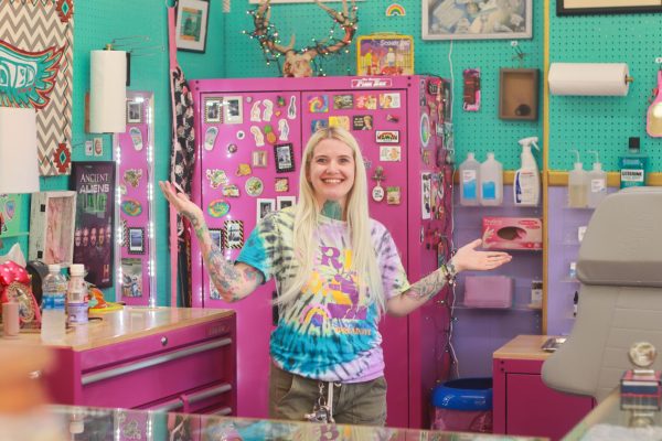 Chelsea Mauney poses in front of Peak Piercings studio located at the High Country Emporium on Aug. 27. The grand opening for Mauney’s self-owned shop occurred in early August after she separated from a well-known piercing and tattoo shop.