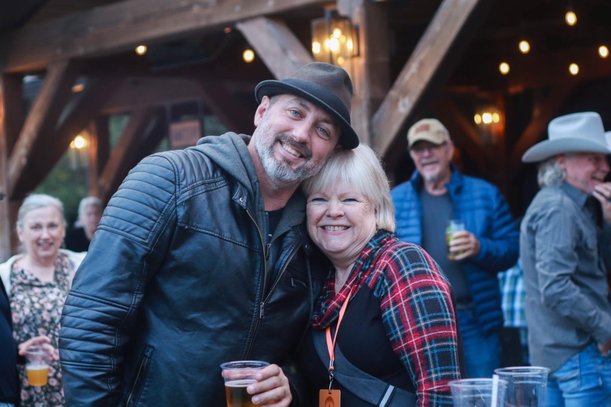 Mother and son duo Carlotta Erdman and Eric Erdman pose at the welcome party for the Antlers & Acorns songwriters festival at Booneshine Brewing Company on Sept. 4. Erdman’s mother has been supporting him since he was young and loves to watch him perform.