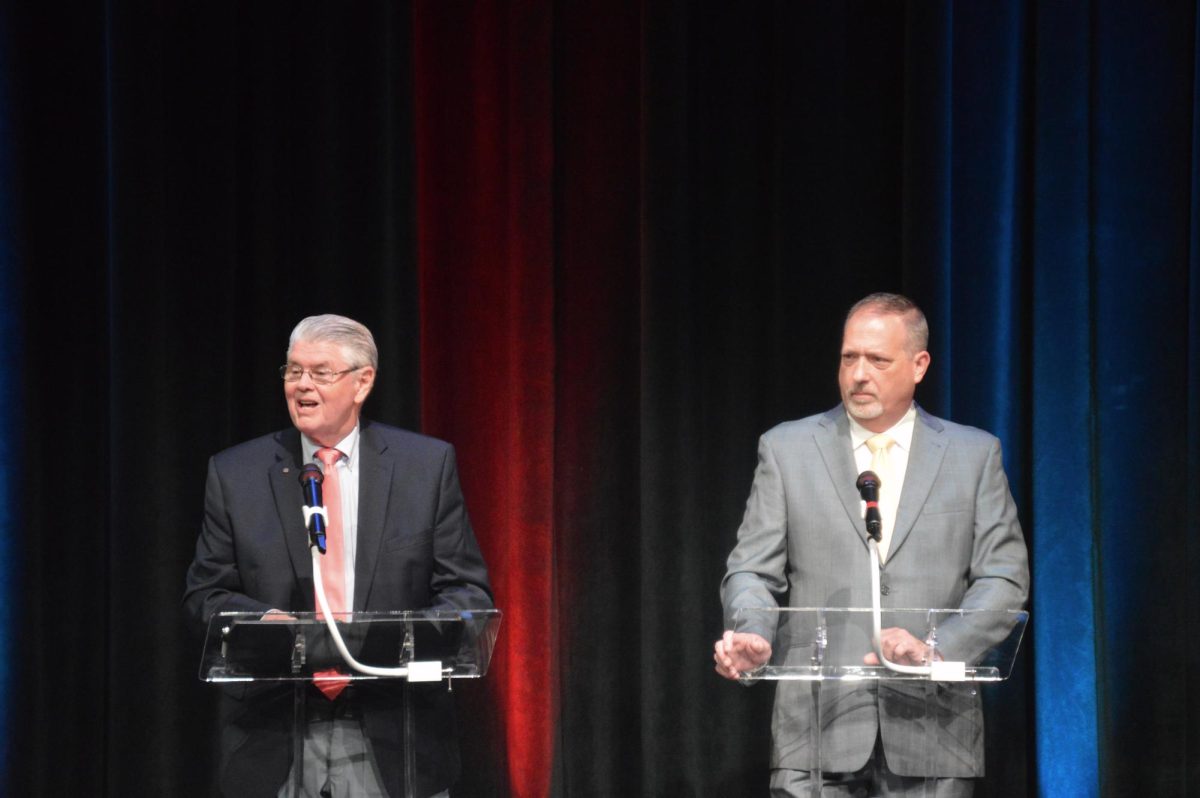 Ben Massey and Ray Pickett stand on stage at the Appalachian Theatre of the High Country discussing issues within their political spheres on Sept. 16.