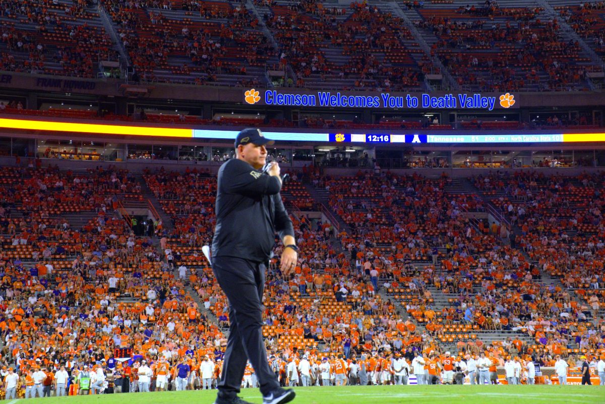 Head coach Shawn Clark walks off the field after calling a time-out in the last quarter of the App State vs. Clemson game on Sept. 7. Clark called in backup quarterback Billy Wiles to relieve Joey Aguilar.