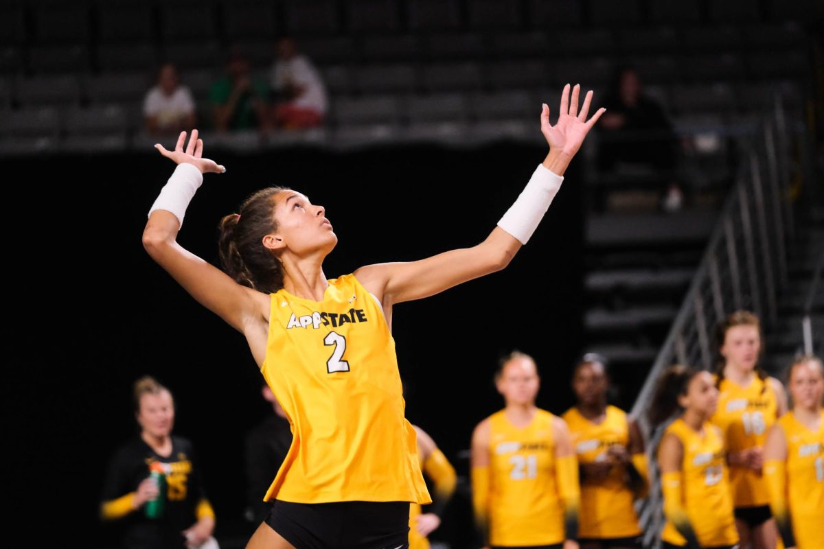 Middle blocker Maya Winterhoff goes to serve the ball at the App State vs. JMU game on Sept. 22, 2023. Winterhoff started in all 29 matches of the 2023 volleyball season.