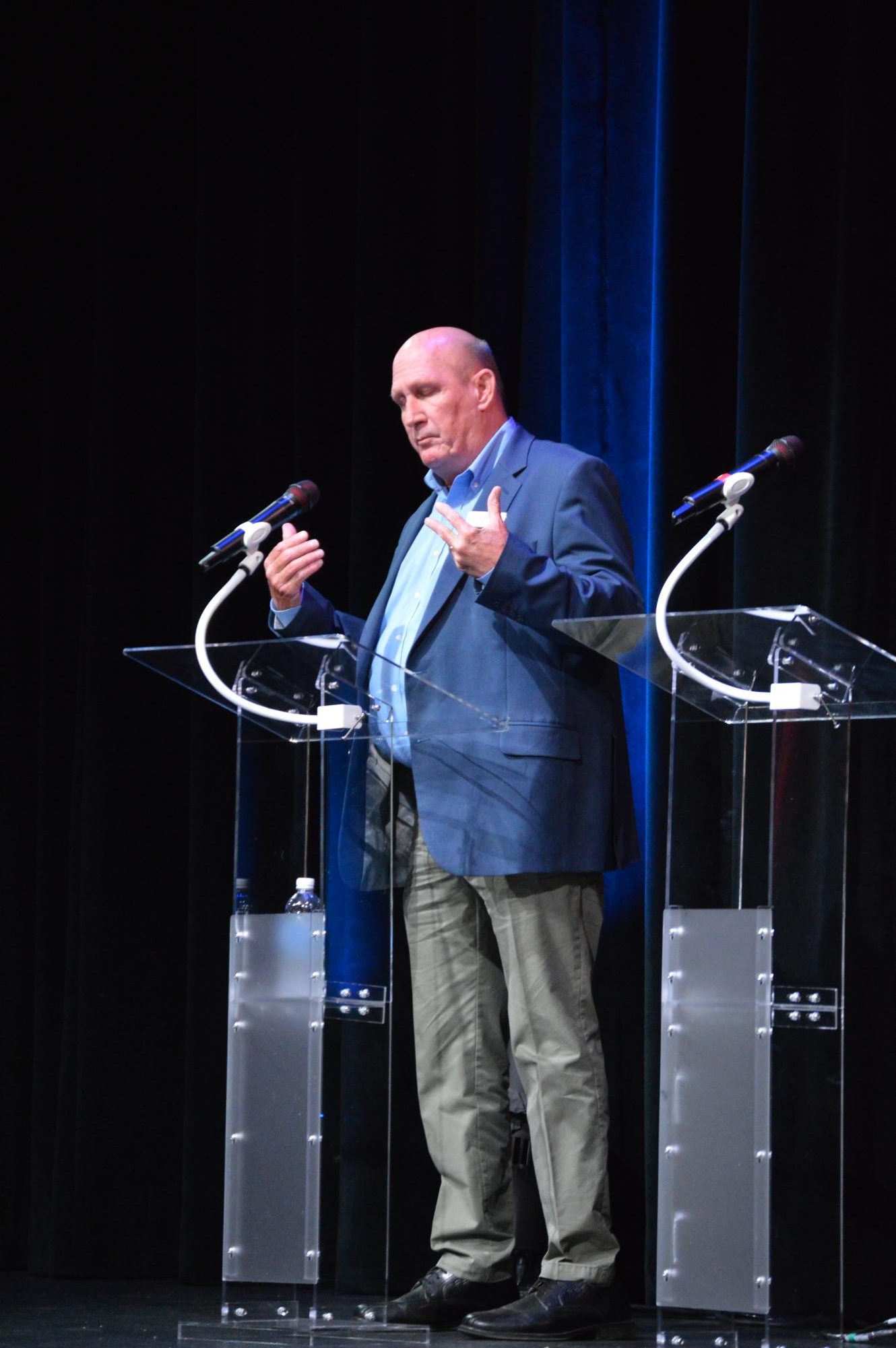 Chuck Hubbard, a former North Carolina journalist and current candidate for the 2024 N.C. House for the democratic party, stands onstage at the Appalachian Theatre of the High Country on Sept. 16. 