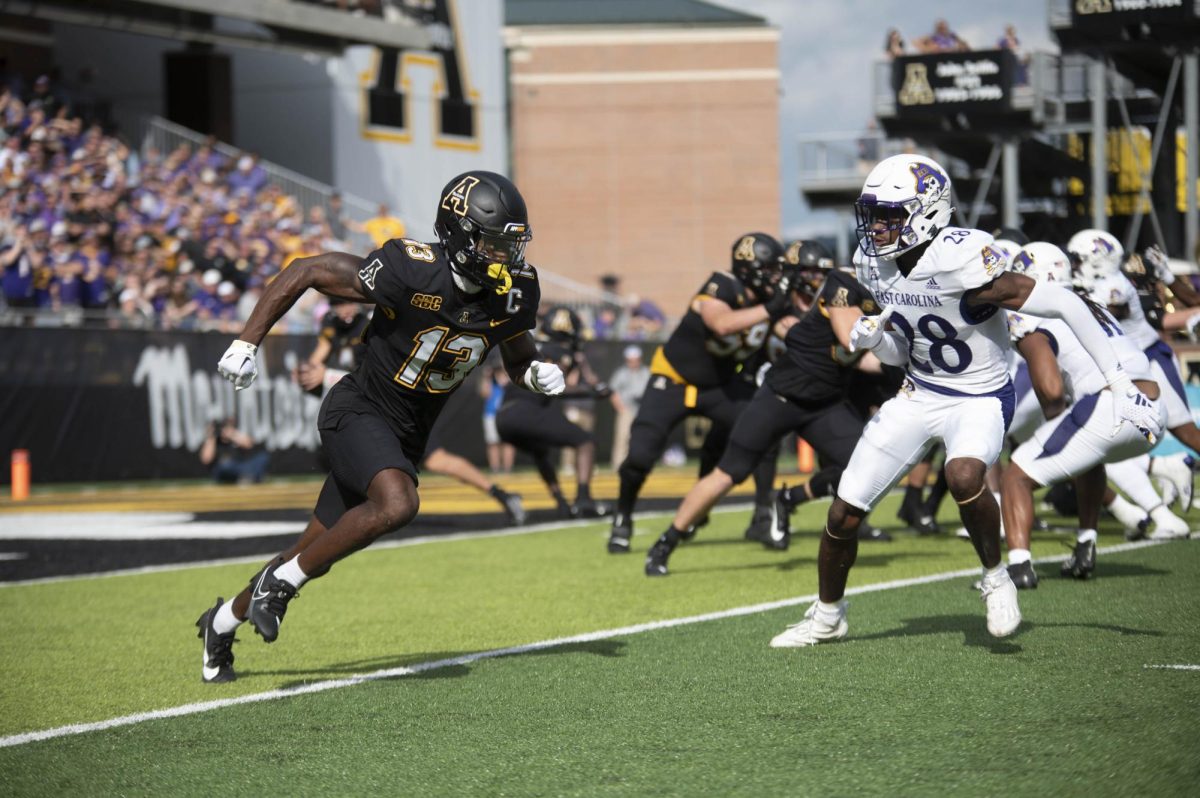 Wide receiver Christan Horn runs around an ECU defender to receive a pass at Kidd Brewer Stadium on Sept. 16, 2023. Horn had 36 catches and 6 touchdowns during the 2023 season.