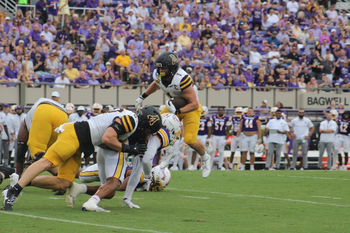 Running back Anderson Castle maneuvers around ECU defenders at Dowdy-Ficklen Stadium on Sept. 14. Castle recorded a total of 40 rushing yards in the game.