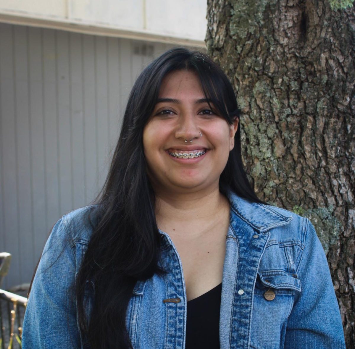  Rubí Escobar, an employee with High Country Community Health, poses for a portrait on King Street on Aug. 29.