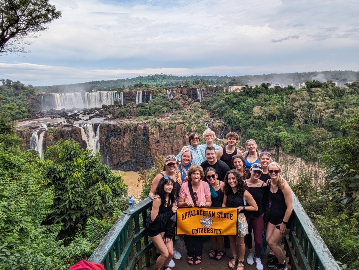 A group of students at Iguacu Falls on the Brazil and Argentina border in May. These falls lie a few miles from the largest hydroelectric plant in the Western Hemisphere, a place the students visited during the program. Courtesy of Marty Meznar.